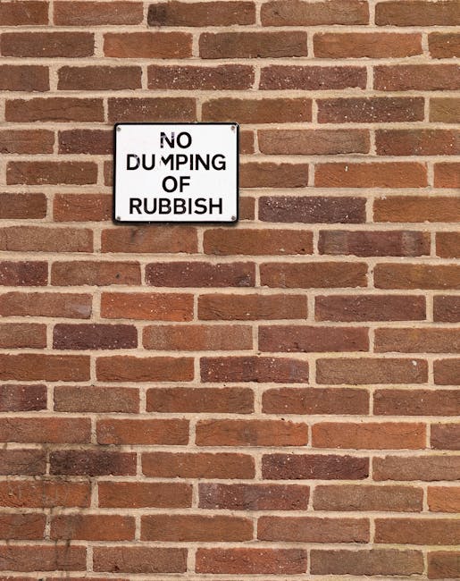 A square white metal sign with black text reading